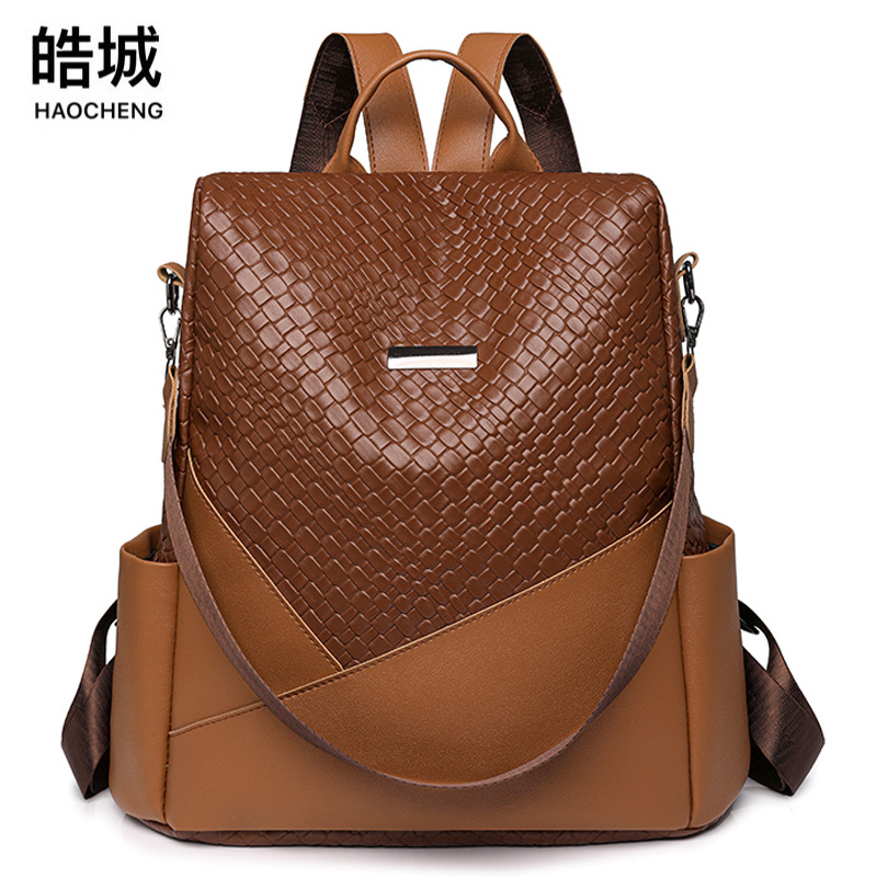 Comercio exterior al por mayor 2024 Nueva mochila antirrobo tejida tendencia de la moda de las mujeres de gran capacidad de doble uso mochila de viaje