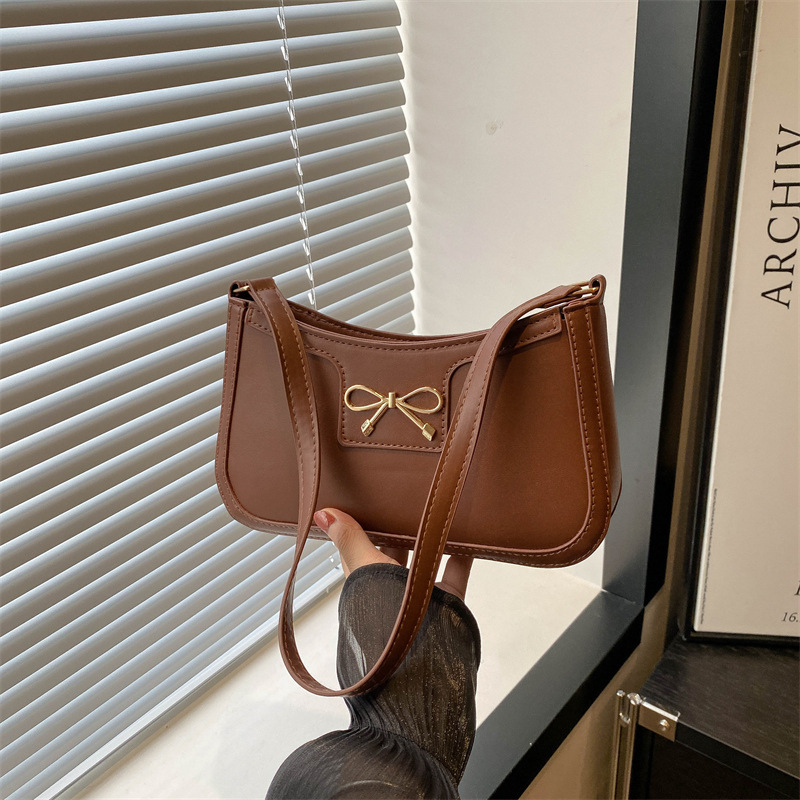 thumbnail image 1 of Bolso de bandolera de moda con lazo bajo el brazo para mujer, nueva colección 2025, estilo coreano, personalidad moderna, elegante y sofisticado, bolso baguette para el día a día., 1 of 10