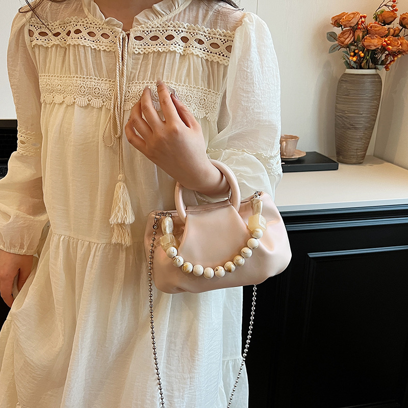 High end handbag for women in 2024, new niche design, summer handheld pleated chain strap, crossbody cloud bag_voghion.com