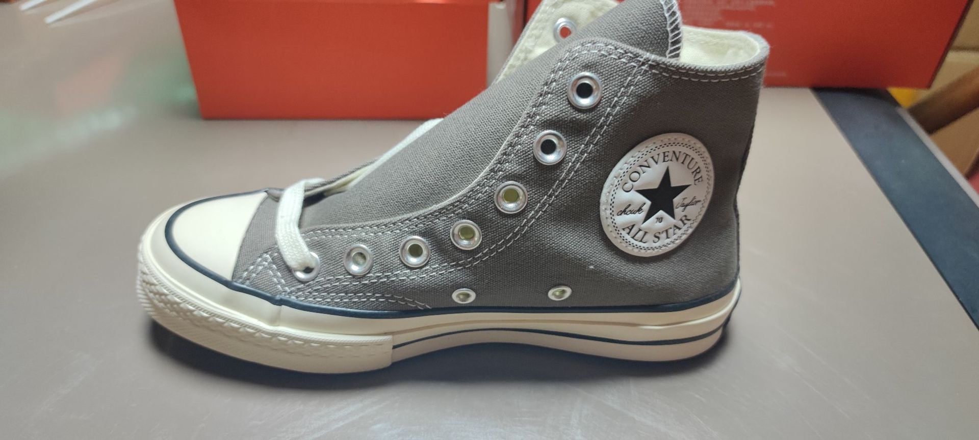 Dark gray high top. it is recommended to take one size smaller