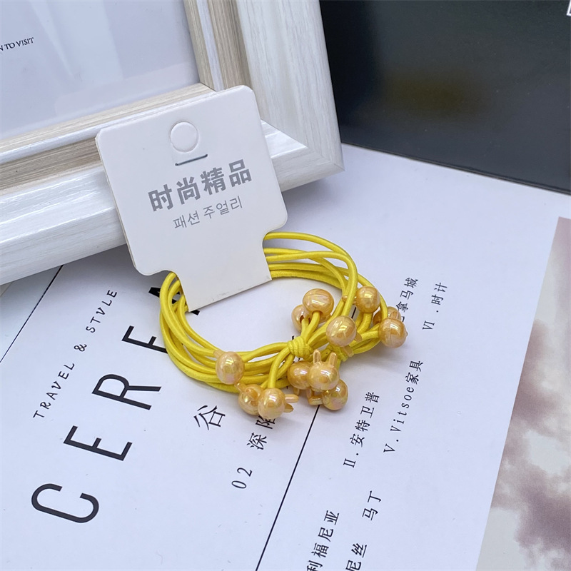 Electroplated AB color caramelo color tres en una tarjeta de dibujos animados banda de pelo banda de goma cuerda de pelo de las mujeres 2 yuanes tienda de accesorios para el cabello