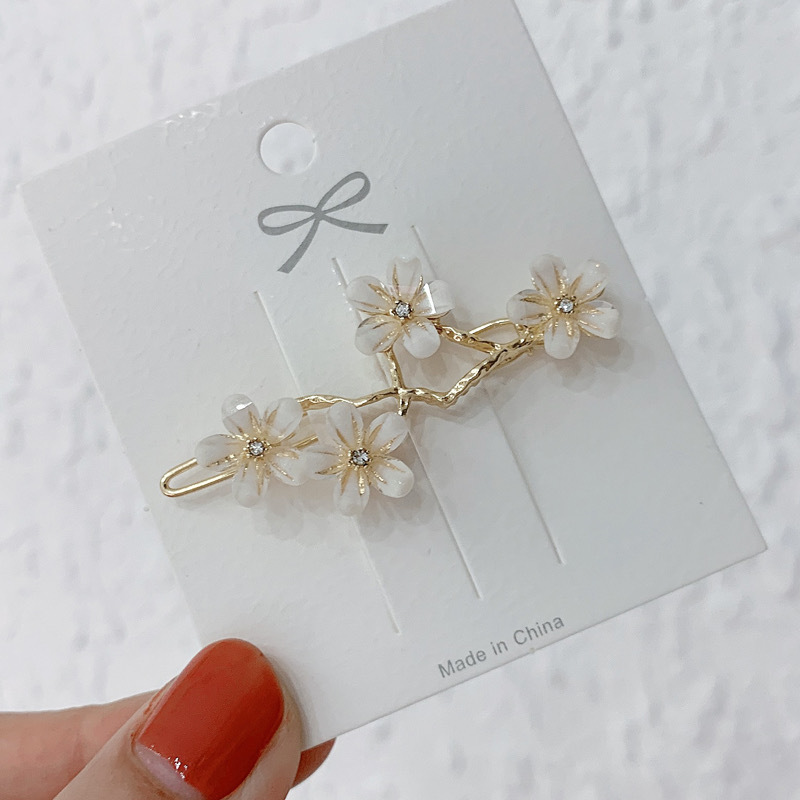 Elegante haarspeld met kattenoogsteen en bloemendesign_voghion.com