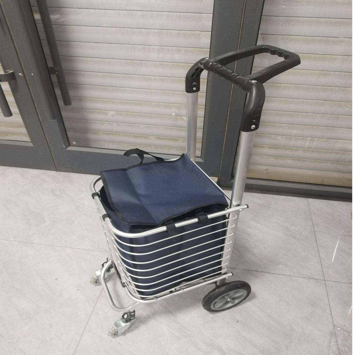 Subir escaleras para comprar verduras, pequeño conductor tirado por mano, carro plegable, portátil multifuncional, anciano, agua embalada para comprar verduras, artefacto mágico, joven