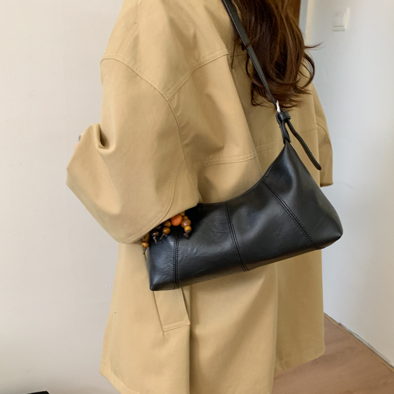 Bolsa de brazo retro transfronteriza para mujeres otoño y invierno 2025, nueva moda de nicho popular, bolsa de hombro universal, bolsa de transporte