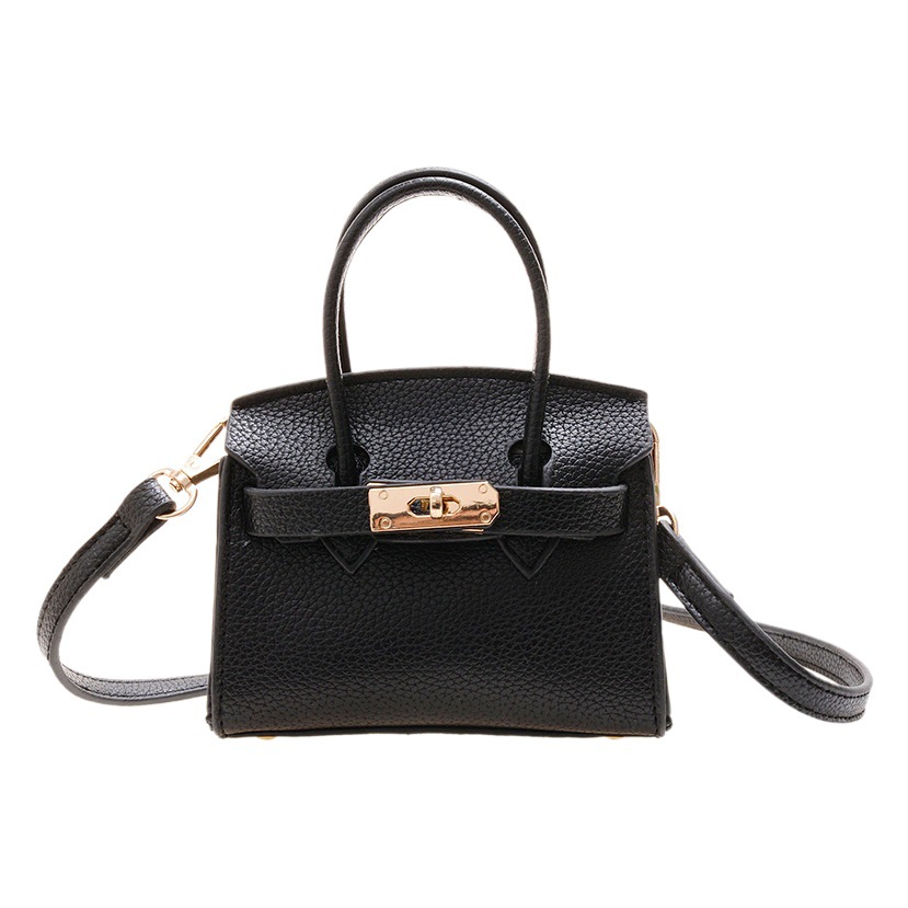 Nuevo estilo coreano cerradura de los niños bolsa simple moda monedero Internet celebridad mini Comercio exterior padre-hijo estilo occidental bolsa de mensajero