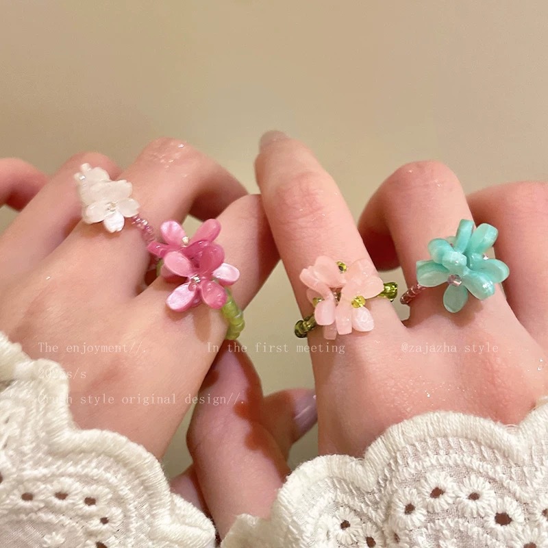 Elastic cute small design ring, orchid, flowered, on index finger