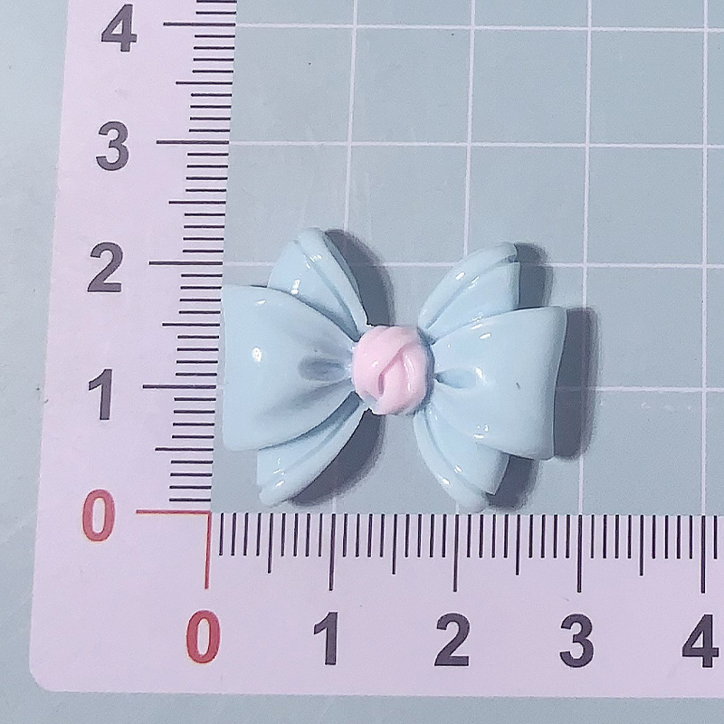 Nuevos accesorios de resina de color macaron de lazo de dibujos animados