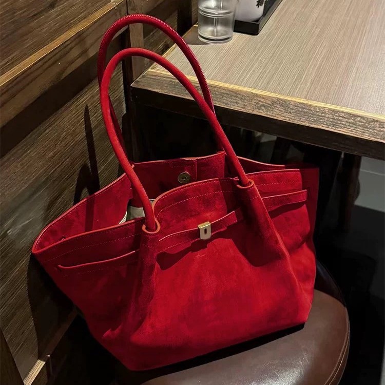 Bolsos de albóndigas de gran capacidad de muntjac rojo estilo femenino 2025 nuevo sentido de alta gama bolsos de bodas de novia de otoño e invierno