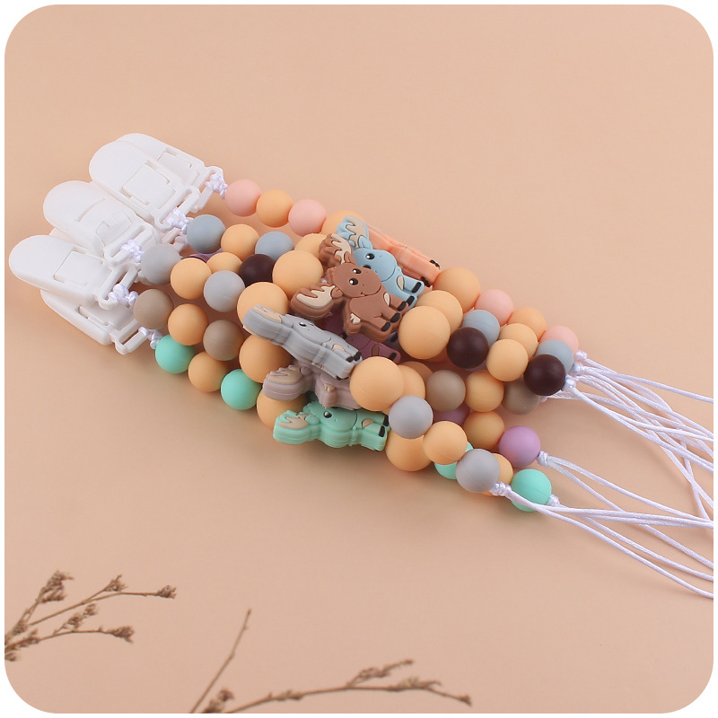 Nuevos suministros para bebés chupete cadena creativa bebé alce de silicona bebé mordedura molar anti-caída de la cadena