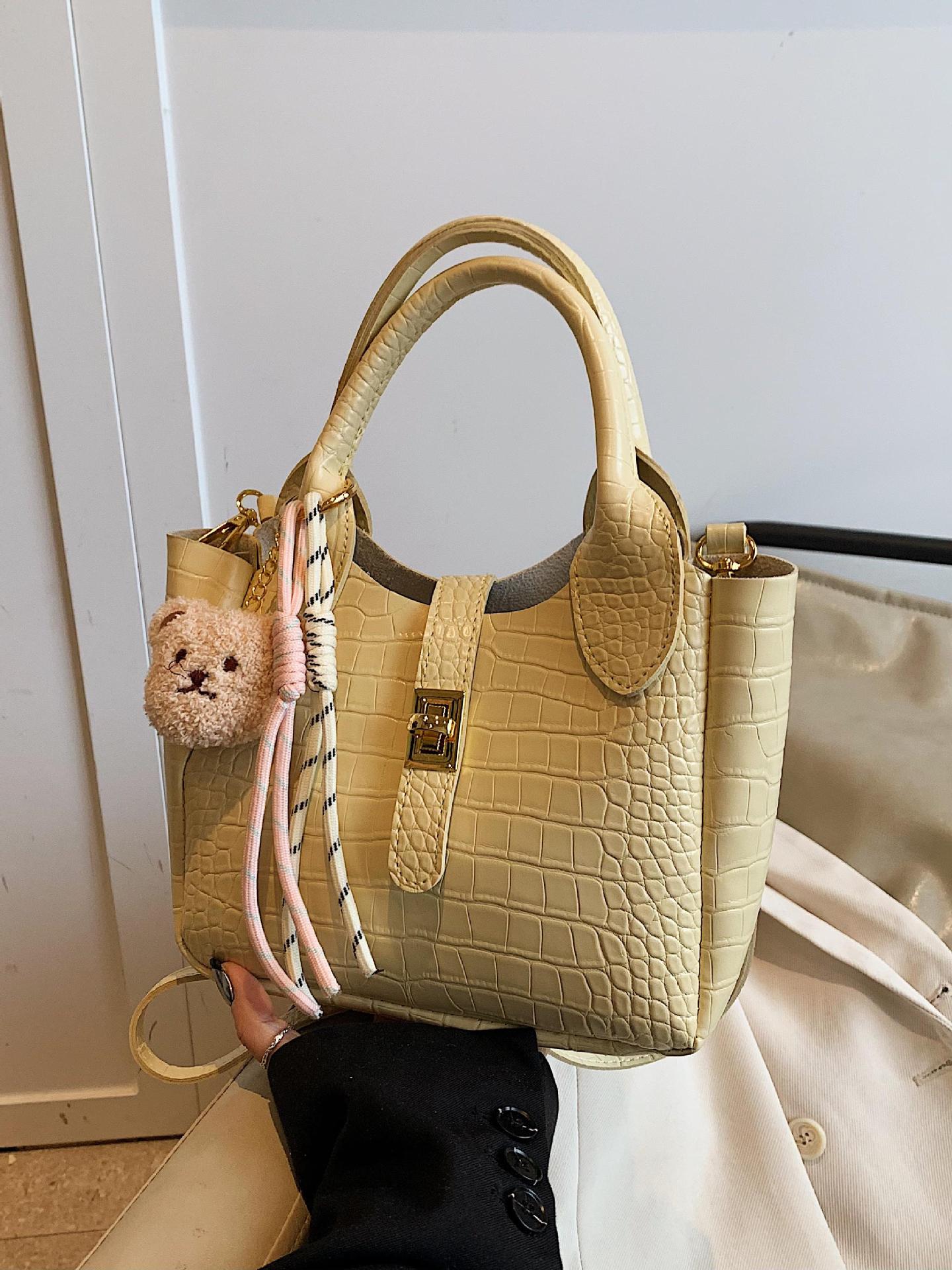 Comercio exterior super fuego patrón de cocodrilo llevar a mano bolso de cubo mujer 2025 nuevo bolso de hombro de viaje de moda bolso de mensajero de todo fósforo