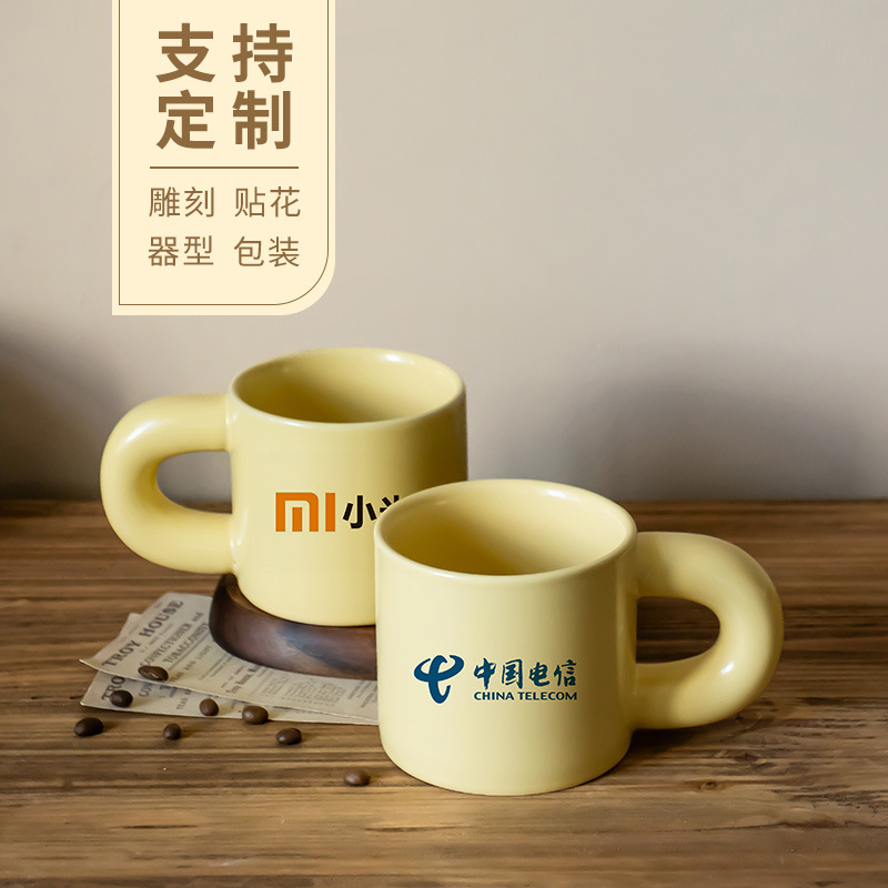 Taza de marcas de impresión, mango de orejas grandes, taza de agua cerámica, taza de té doméstica, taza de café