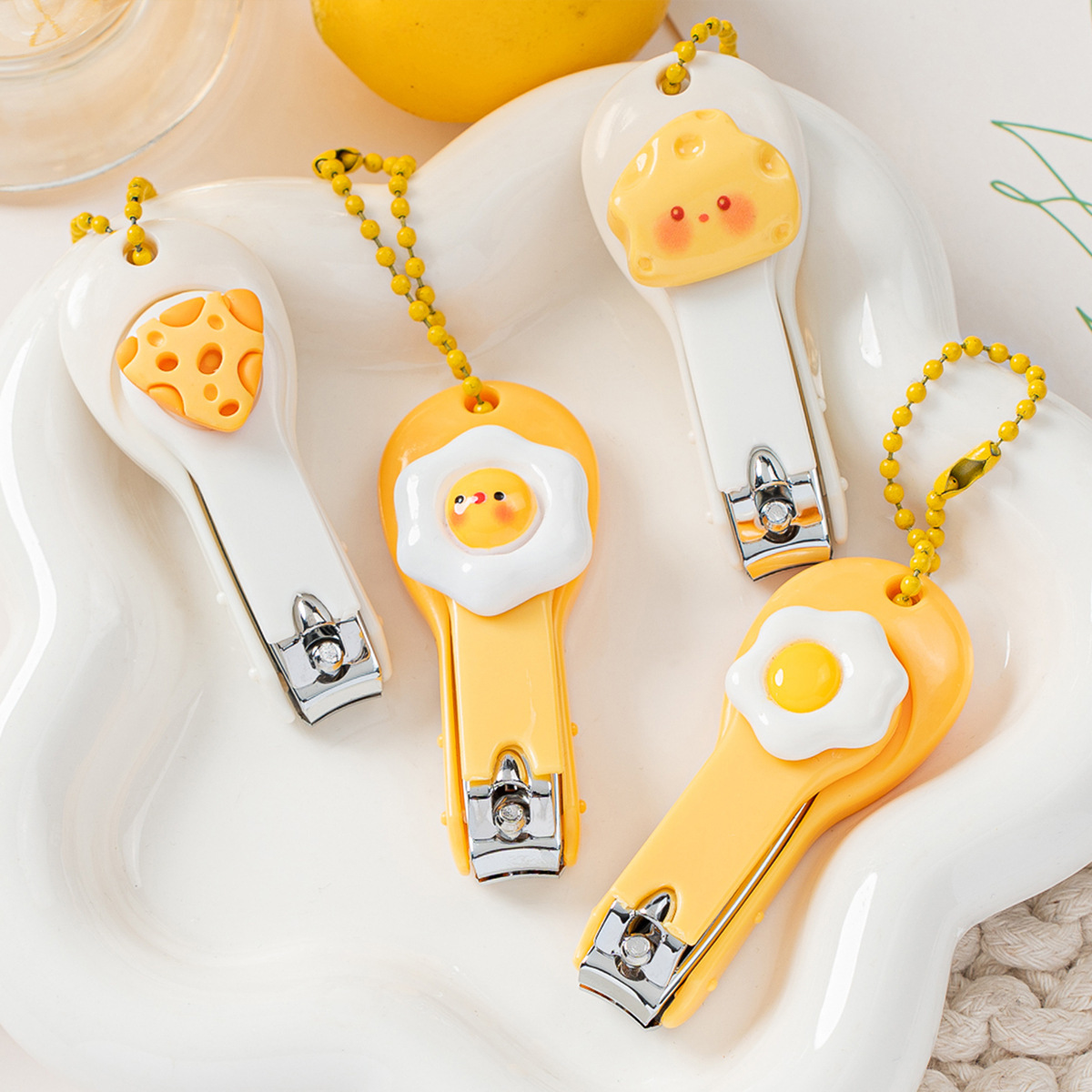 New and cute cartoon cheese and fried egg-shaped nail clippers, suitable for home use, designed to prevent nail clippings from flying around during manicures