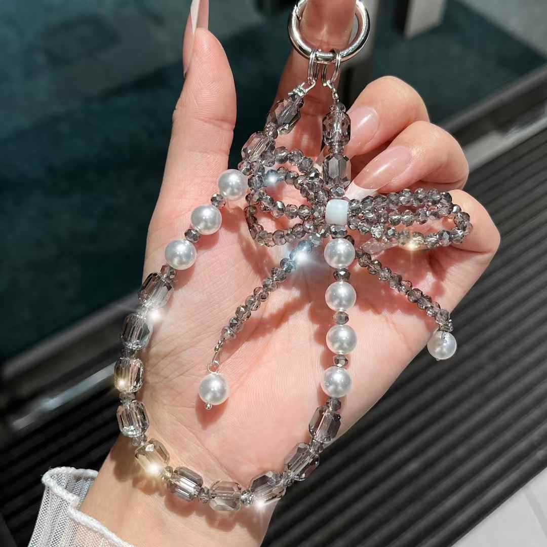 cadena de teléfono móvil estereoscópico de alta calidad arco de cristal caja de teléfono móvil colgante perla cuerdas de muñeca cuerdas de cuentas mujeres