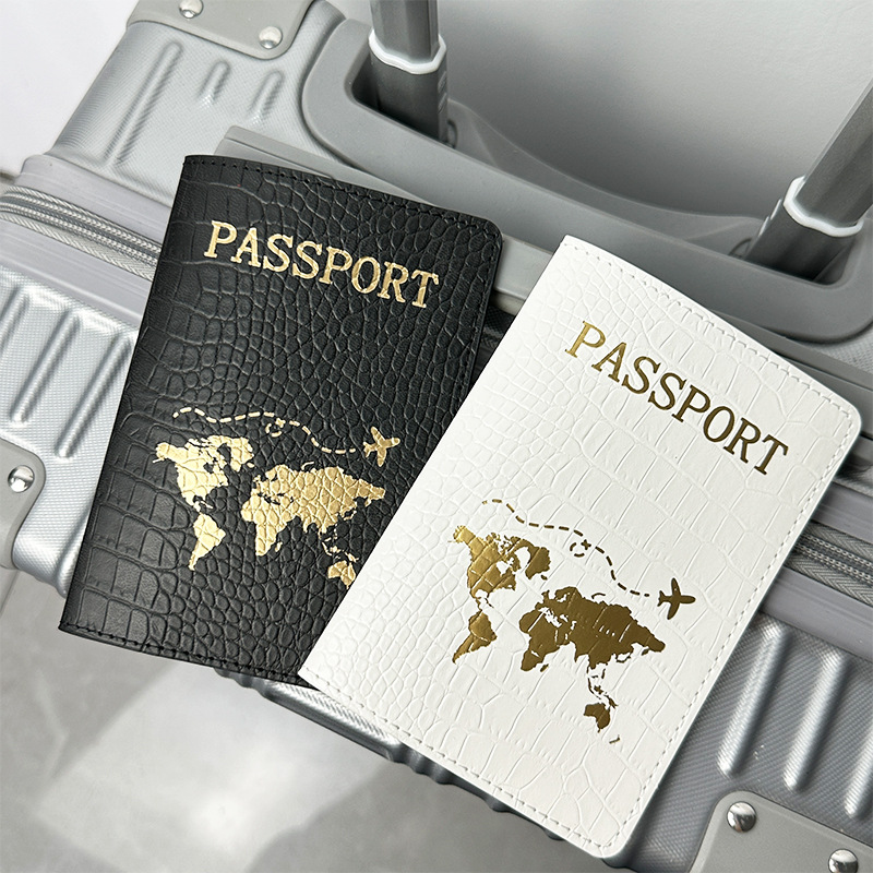 Spot Cross-border PU cuero patrón de cocodrilo protección de pasaporte este conjunto de clip de pasaporte de cuero estampado en caliente mapa bolsa de pasaporte en blanco y negro