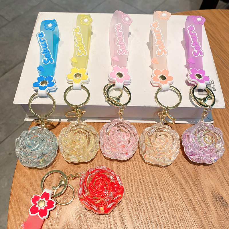 Llavero de rosa de aceite creativo lindo líquido arenas movedizas colgantes pequeños bolsos accesorios pareja pequeños regalos al por mayor