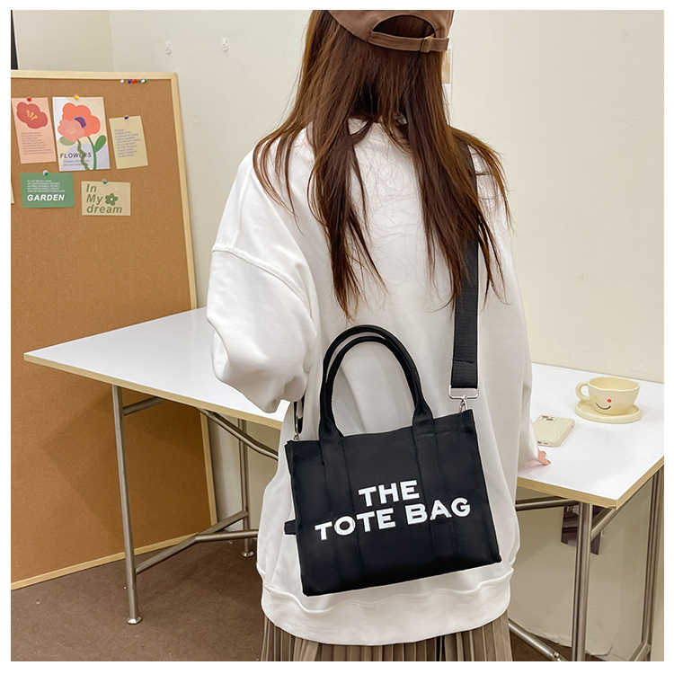 Bolso de lona Hebei Baiou para mujer, de color sólido con estampado de letras, bolso bandolera de un solo hombro con estampado de letras.