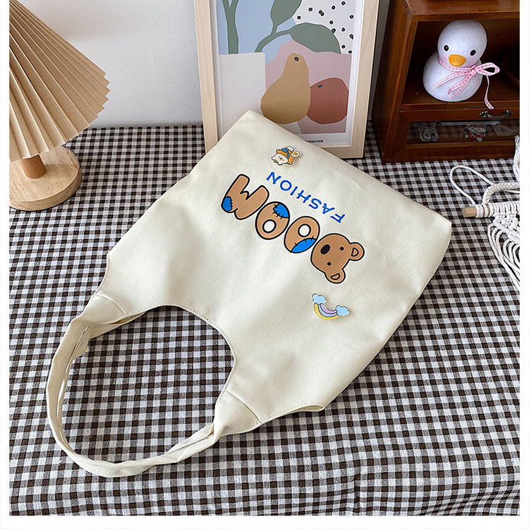 2021 Summer Japanese-style simple canvas bag, student backpack, single-shoulder handbag for going out, cartoon badge cotton bag undefined