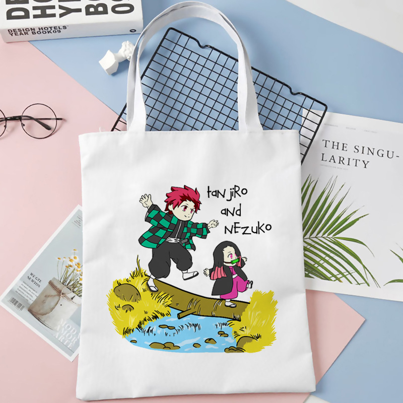 Comercio exterior transfronterizo Demon Slayer impresa bolsa de lona Harjuku bolsa de hombro bolsa de compras portátil de moda para estudiantes