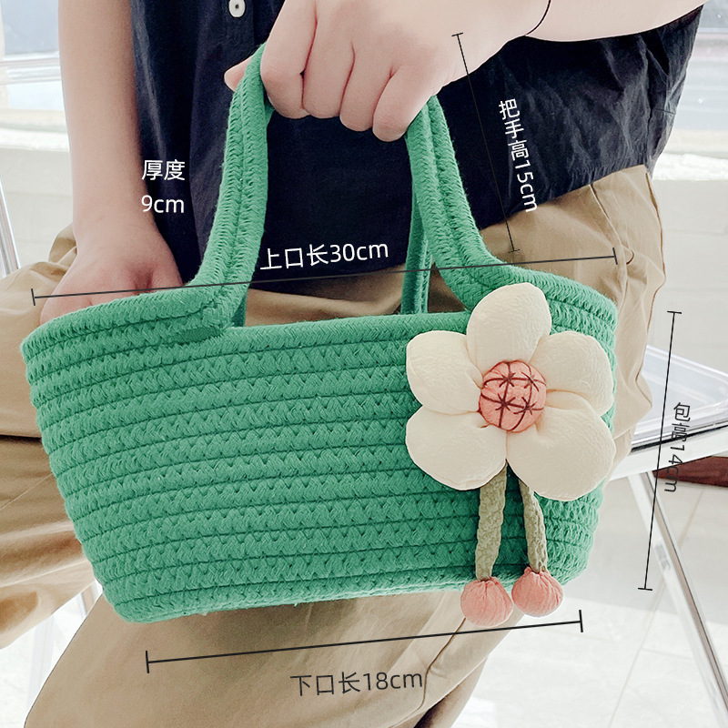 El bolso de mano de cuerda de algodón tiene un mango verde de una sola flor de 27 * 7 cm de ancho en la parte superior, 16 * 7 cm de ancho en la parte inferior y 15 cm de altura y 7 cm de espesor.