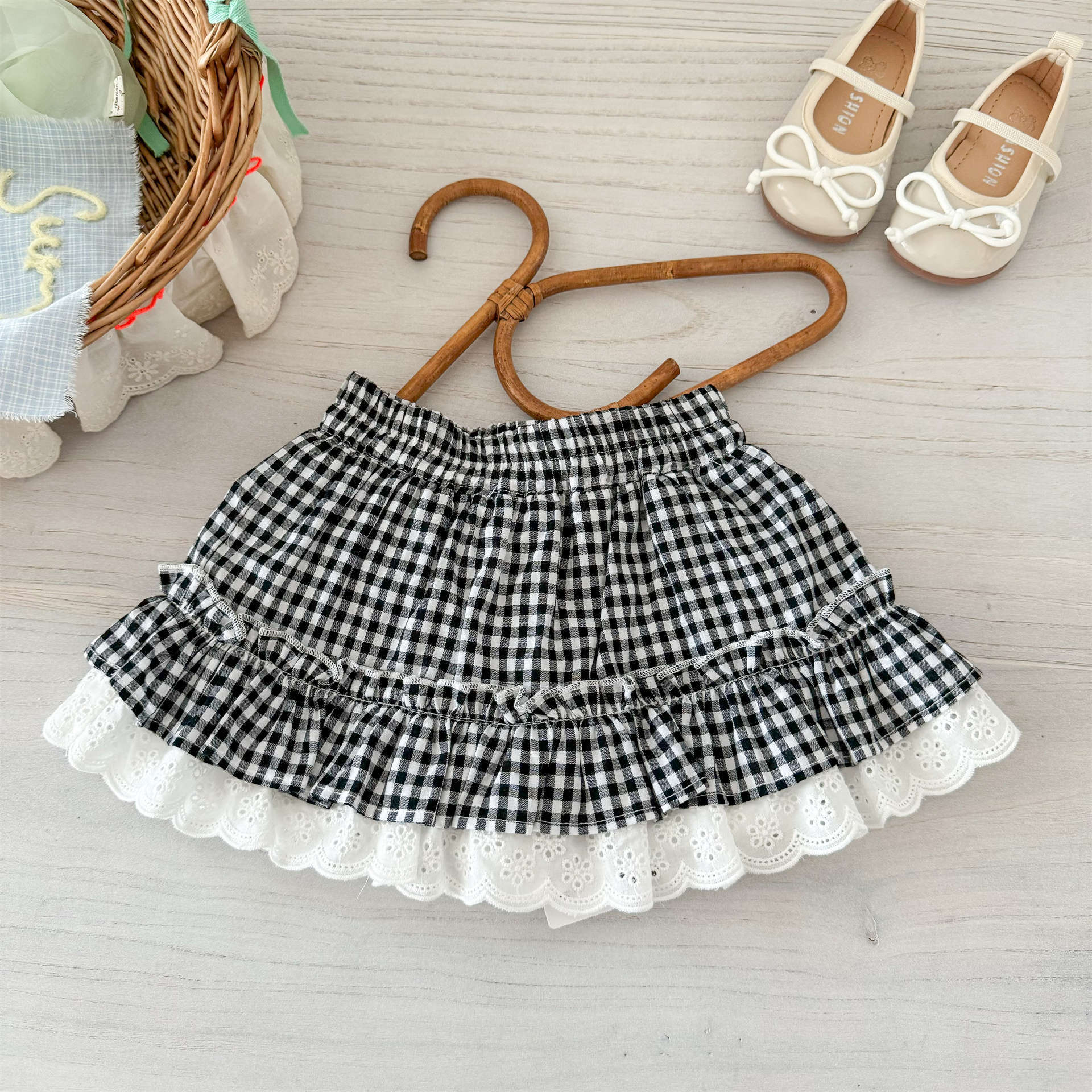 Xianning siete ropa para niños falda corta para niñas 25 verano nuevo estilo estilo occidental bebé falda de pastel a cuadros única y hermosa