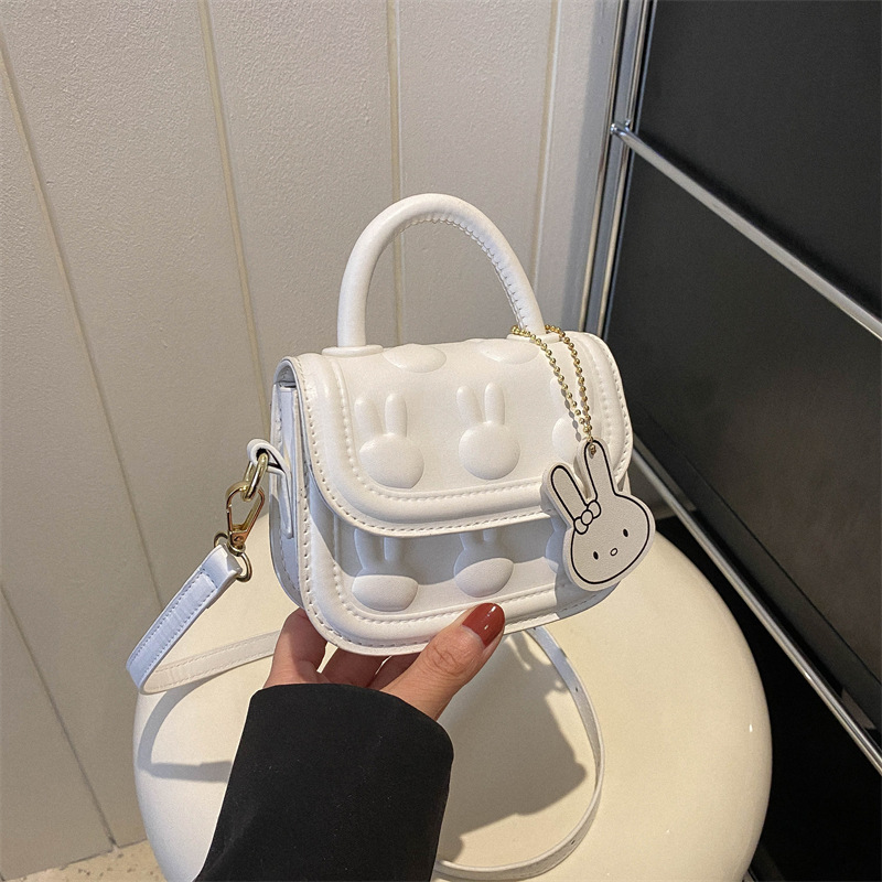 Bolsos para niños, bolsos de mochila encantadores, bolsos de moda de dibujos animados, bolsos de montar de mano, bolsos de cambio para bebés de niñas