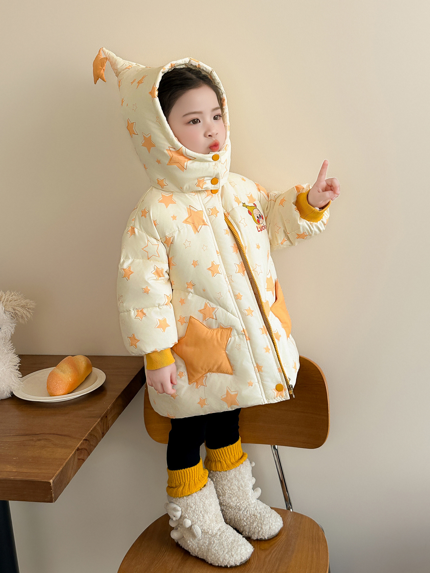 Chaqueta de plumón de niñas invierno 2025 nueva princesa bebé de caricatura ropa de invierno mediana y larga para niños chaqueta de camisa blanca