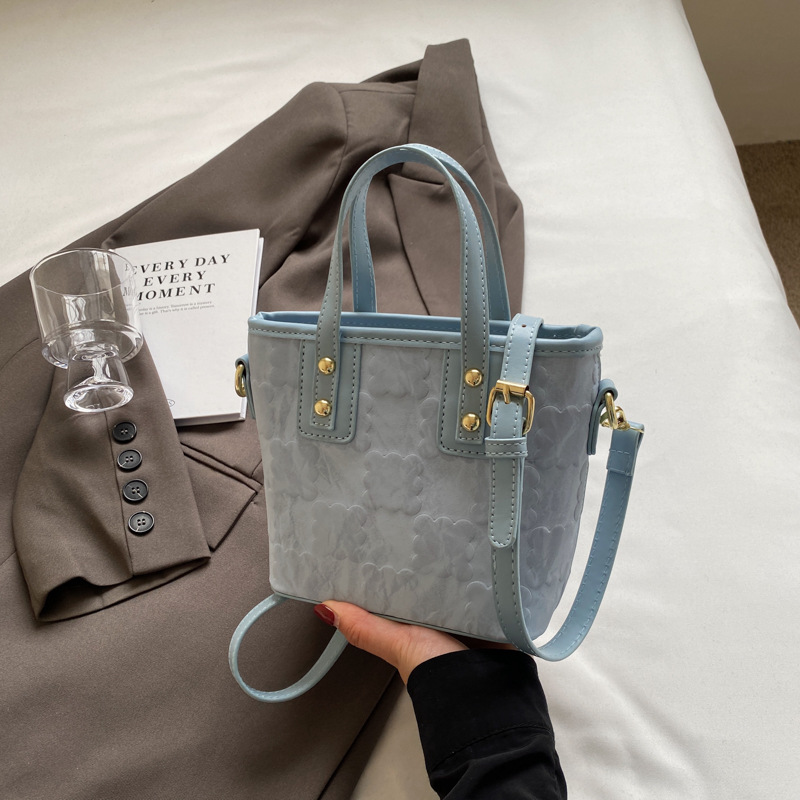 Bolsa de cubo de mano de moda coreana para mujeres primavera y verano 2024 nuevo nicho casual de moda universal mochila de hombro