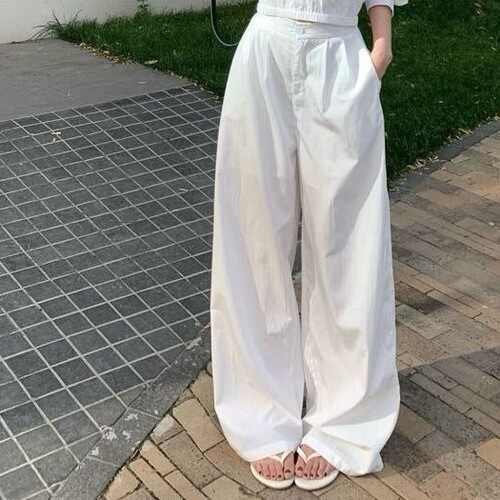 Designer-style spicy white cross-cropped long-sleeve shirt for women, summer fashion set with relaxed wide-leg pants, two-piece set