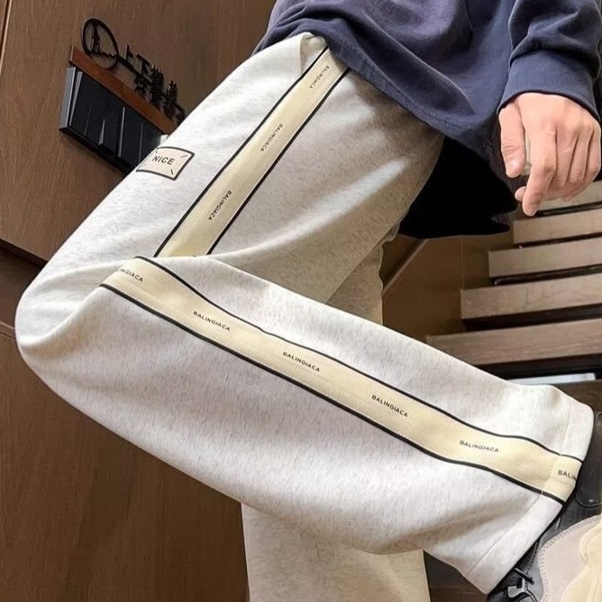 Pantalones casuales de hombre, tendencia de otoño y invierno, pantalones rectos de tamaño grande, pantalones deportivos elásticos de cintura delgada y caída.