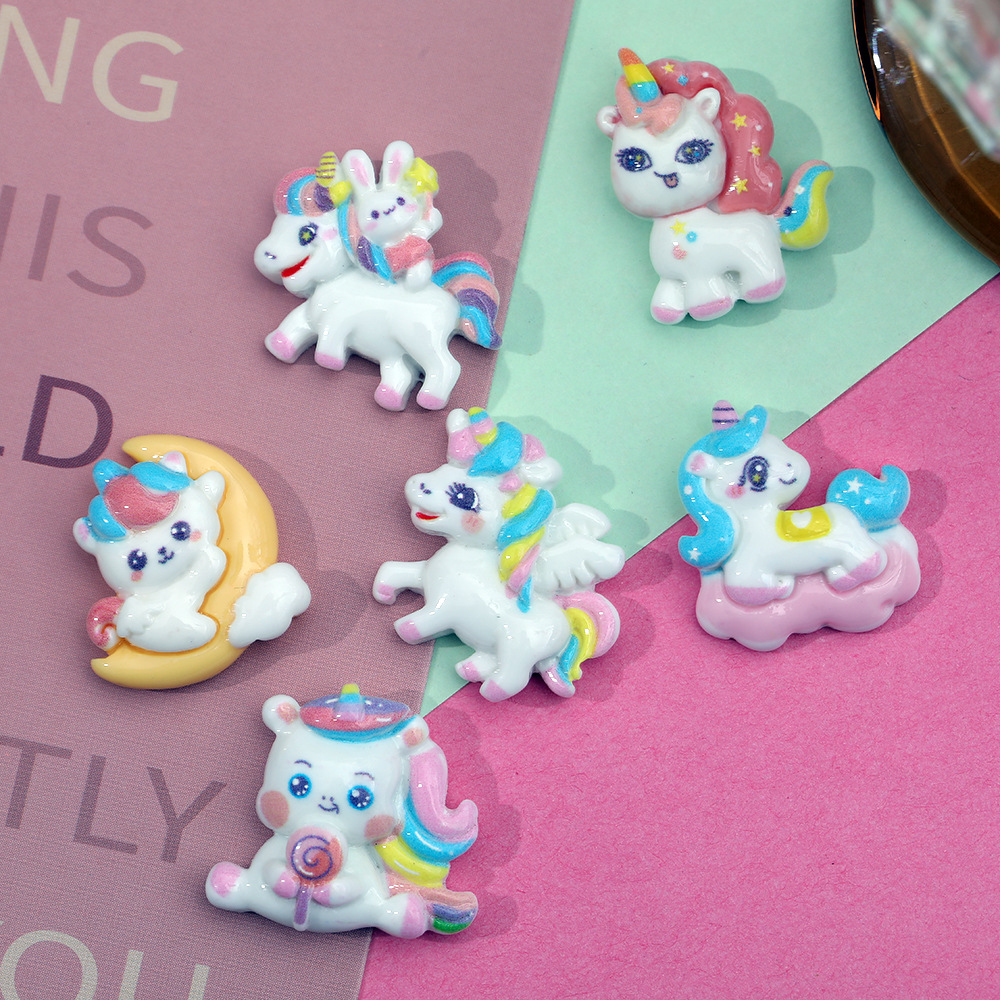 Dibujos animados Luna unicornio accesorios de resina DIY accesorios para el cabello teléfono móvil Shell papelería clave colgante hecho a mano material al por mayor