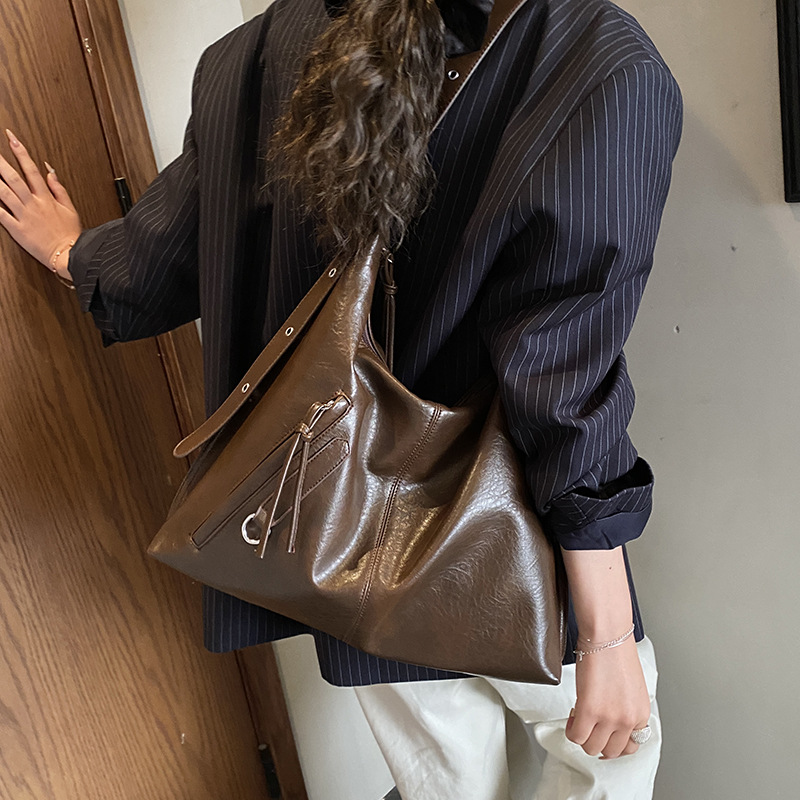 Bolsa de viaje retro de alta calidad para mujeres 2025 invierno nuevo estilo de moda multifuncional bolso de hombro de textura de moda bolso de brazo
