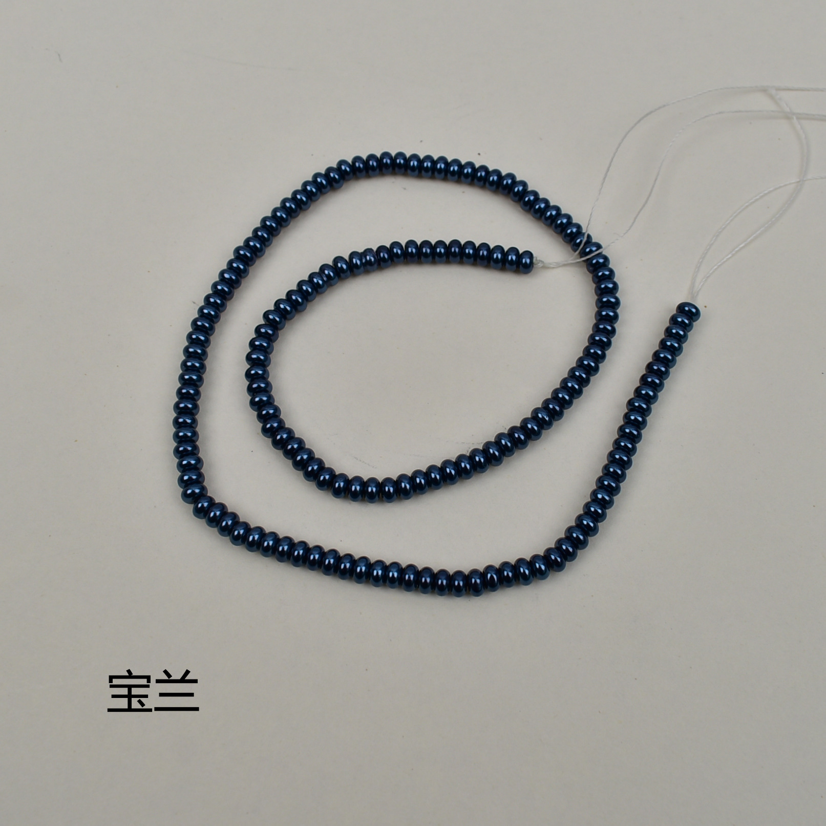 Royal blue flat beads 2*4mm, about 150 in a string