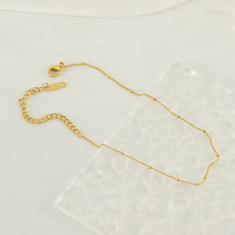 Transfronterizos Europa y América simple cinturón de perlas lateral cadena de pie pie de acero inoxidable chapado en oro 18K universal acero de titanio tobillas de mujer