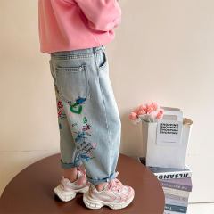女の子のジーパン2025春の服の新型子供の春の子供服の女の子のズボンの赤ちゃんの漫画の落書きのズボン