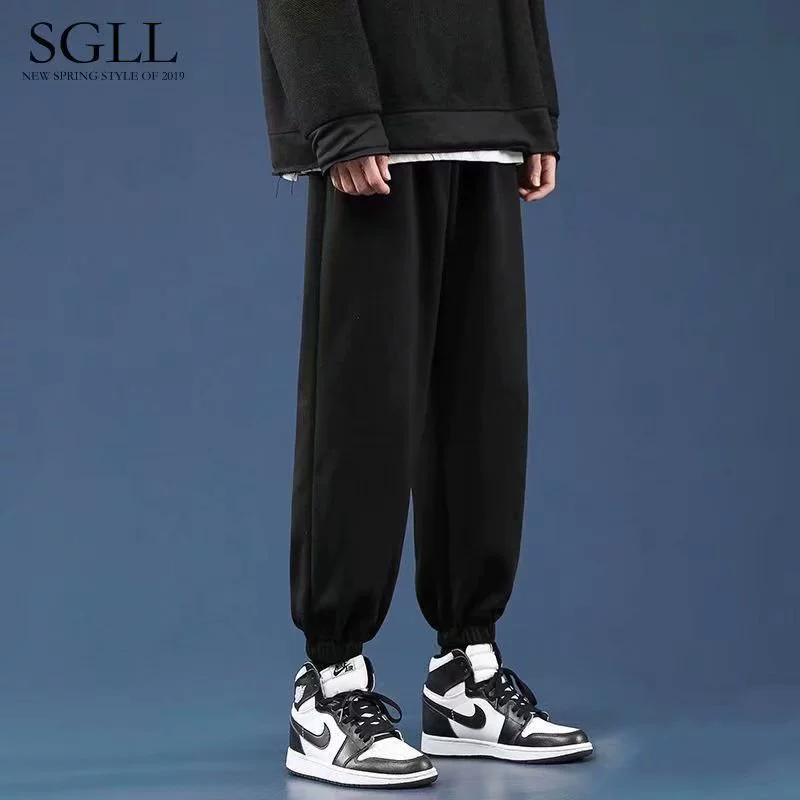 Мужские брюки Весенние летние тенденции дикие повседневные сплошные новые спортивные брюки свободные брюки с защитными брюками мужские живые брюки