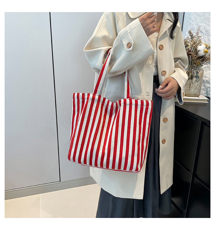 2024 Autumn/Winter new versatile and fashionable striped handbag shopping bag, two-tone large-capacity trendy single-shoulder bag undefined