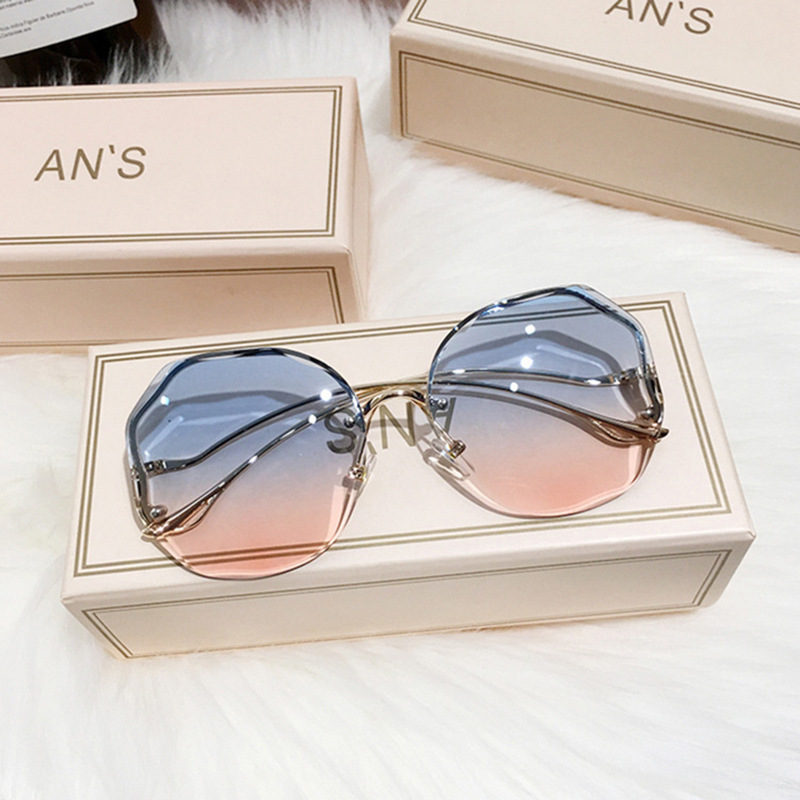 Gafas de sol sin montura grandes para mujer, patillas metálicas curvas, moda y protección UV, estilo de moda image 11