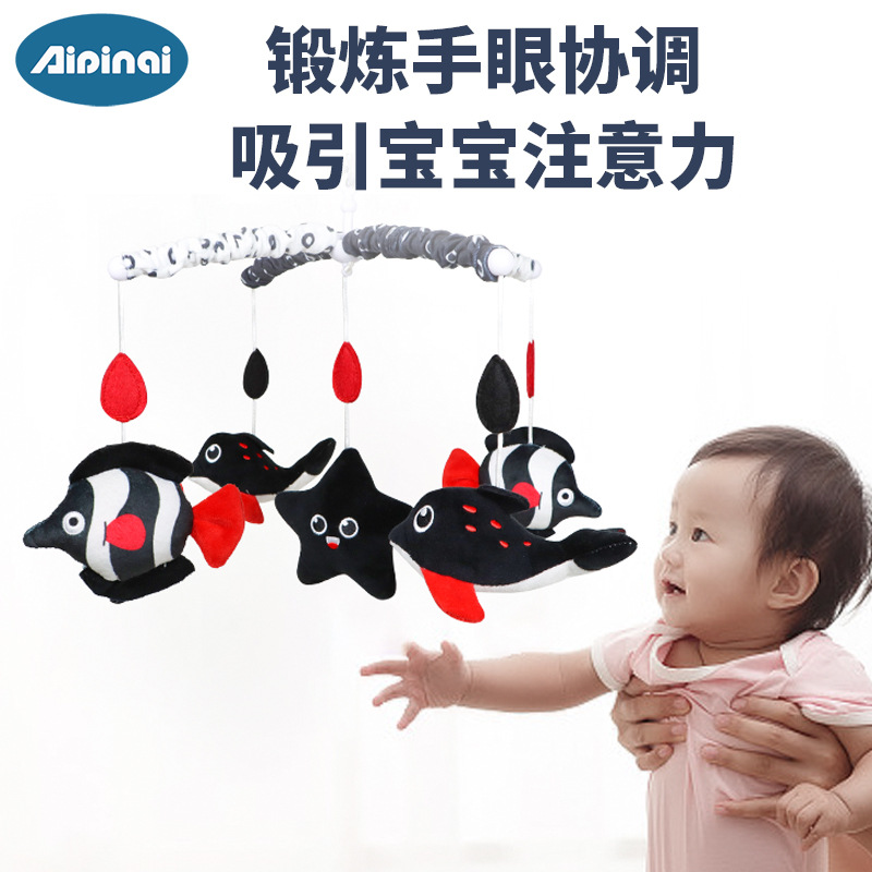 Nueva cama giratoria de música para niños Bell bebé anti-estrabismos cama colgante de juguete negro y rojo bebé felpa campana de noche al por mayor