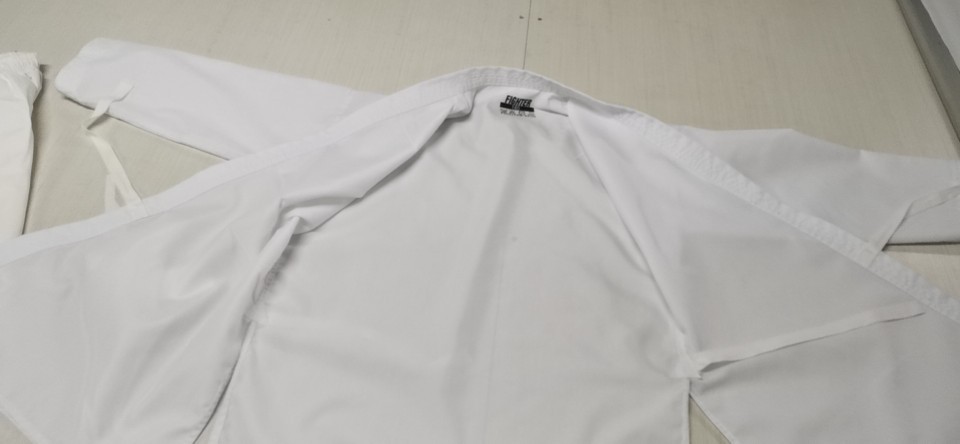 Factory sells karate uniforms for children and adults, including karate and taekwondo attire.