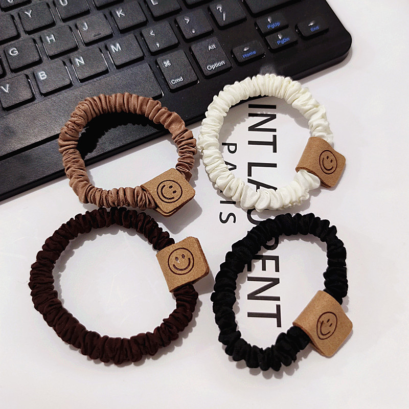 Brown smiley hair band