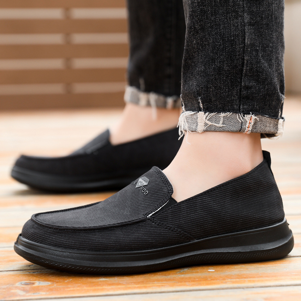 Zapatos de hombre primavera nuevos zapatos casuales cómodos de un pie zapatos de lona transpirables de suela suave zapatos de papá al por mayor