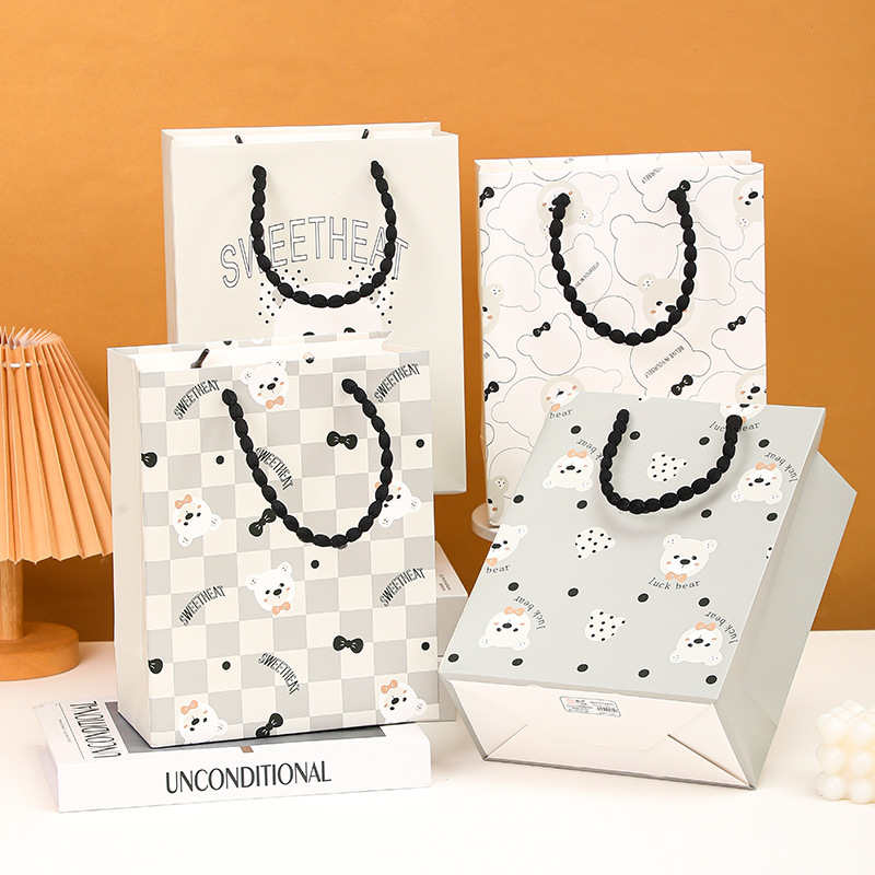 Nuevas bolsas de regalo exquisitas con diseño de animales de dibujos animados en relieve con cuerda de burbujas, directamente del fabricante, para el Día de la Mujer y San Valentín.