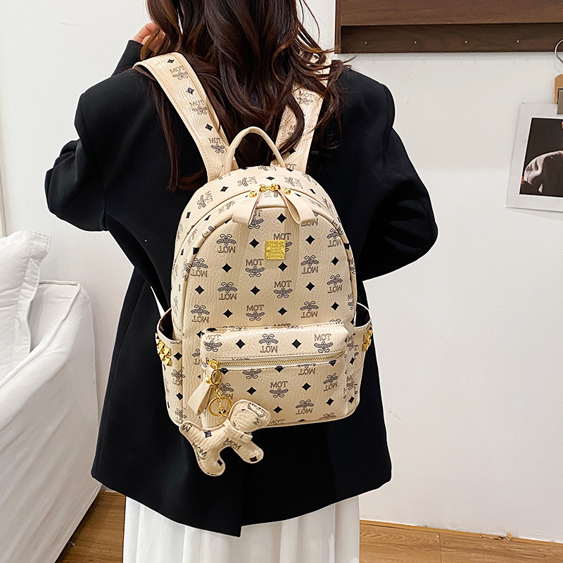 Mochila de moda coreana impresa para mujeres, mochila de clase para estudiantes universitarios, adornos colgantes, mochila de viaje de gran capacidad para mujeres