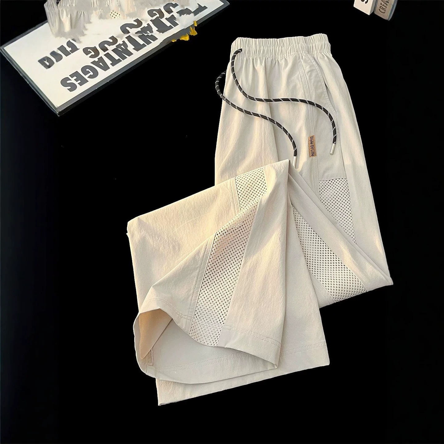 Pantalones para hombres 2026 nuevo verano hielo malla delgada transpirable suelta pantalones de verano para hombres