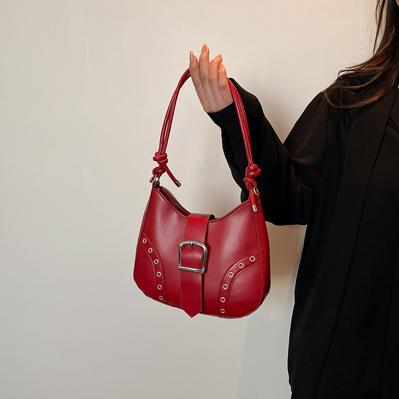 2025 nuevo bolso de verano bolso de axila mujer remache de alta gama moda de nicho bolso de hombro de todo fósforo