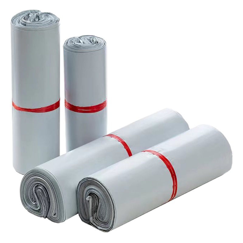 Fabricante de Huaxu al por mayor bolsas express bolsas de embalaje logística bolsas impermeables engrosadas en color materiales nuevos en blanco y negro