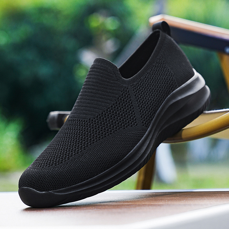Zapatos de hombre de primavera de un pie de calzado de calzado ligero con suela suave zapatos de marcha transpirables zapatos de malla hueca cómodos zapatos de moda casuales
