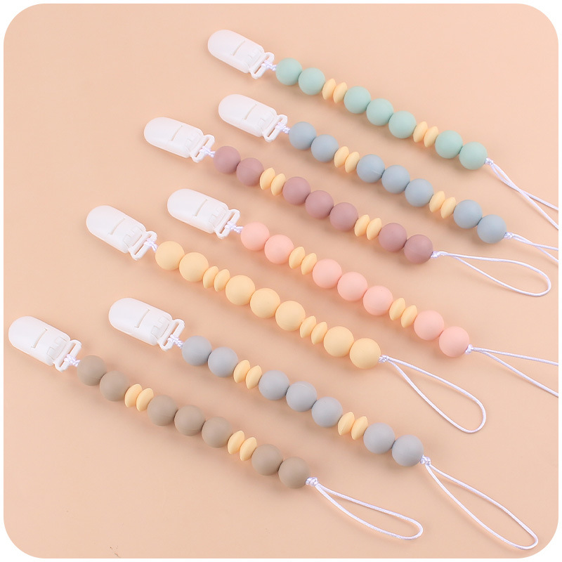 Nuevo bebé suministros chupete cadena creativa DIY macaron color serie mordedura de pegamento cadena anti-caída
