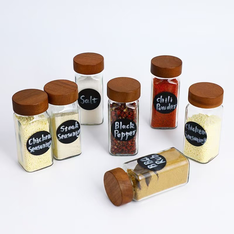 Botella de condimento de vidrio transparente cuadrada sellada cubierta abierta botella de condimento de cocina botella de condimento fábrica directa