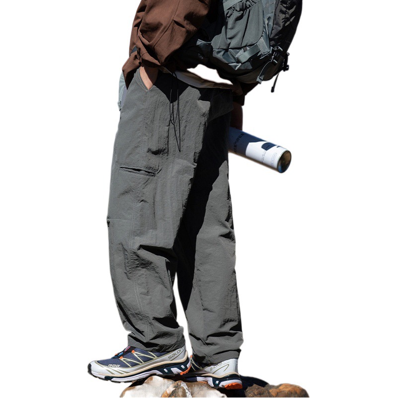 Pantalones casuales rectos al aire libre de montaña primavera para hombres nuevo estilo japonés diseño de cinturón de hebilla suelta pantalones de viento funcionales